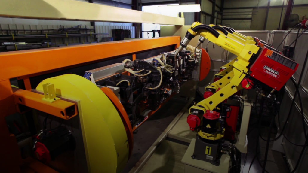 Four FANUC Arc welding robots weld a trailer hitch. (Photo: CC by TranTek Automation)