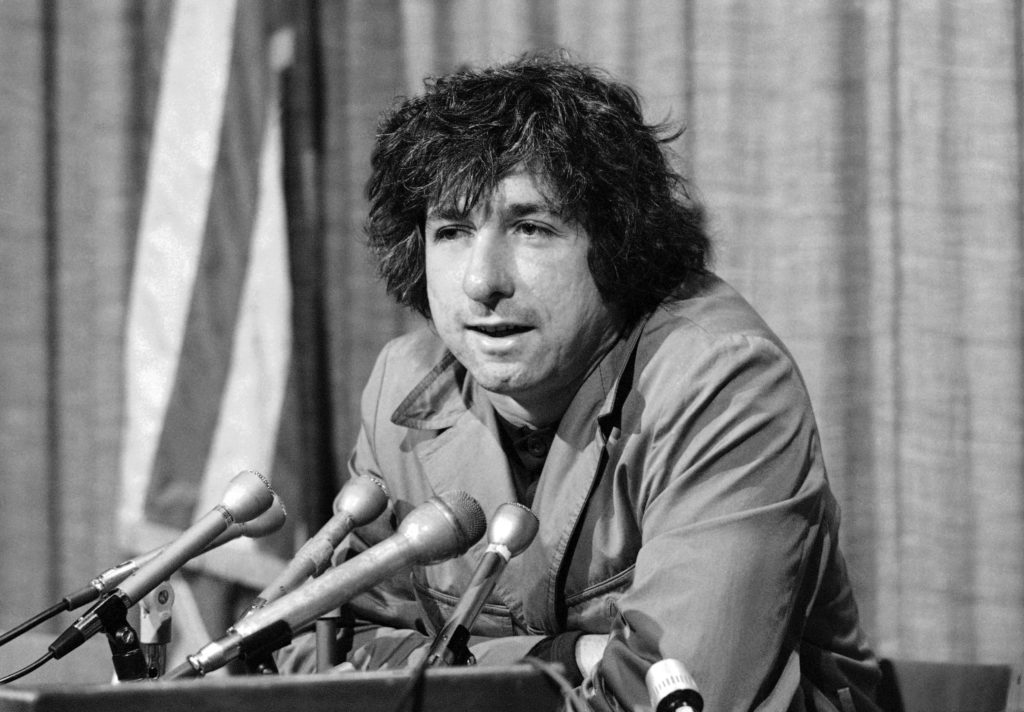 In 1973, political activist Tom Hayden tells members of the media that he thinks public support was partially responsible for the decision not to send him and others of the Chicago Seven to jail for contempt. (George Brich/AP)