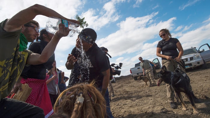 Dakota Access Pipeline protestor being treated after pepper sprayed by private security contractors on land being graded for the oil pipeline, near Cannon Ball, North Dakota. Robyn Beck/Getty