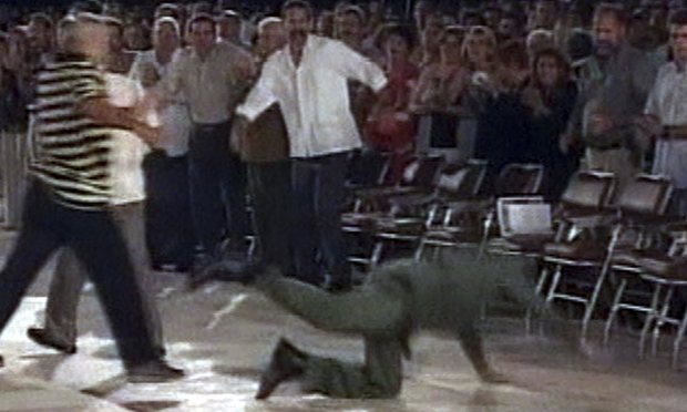 Castro falls badly after a speech in Santa Clara in 2004. Photograph: AP
