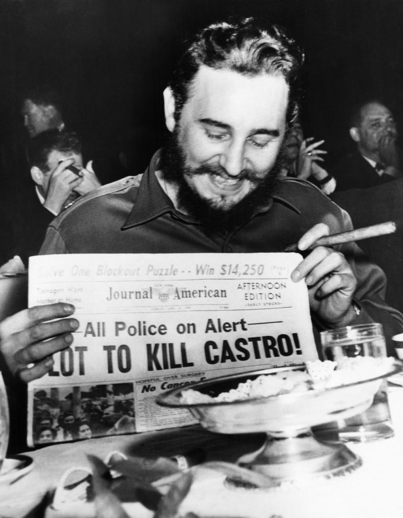  Castro holds up a newspaper in New York in 1959. When asked about a reported assassination attempt, Castro had replied, ‘In Cuba, they had tanks, planes and they run away. So what are they going to do here? I sleep well and don’t worry at all’ Photograph: Bettmann/Corbis