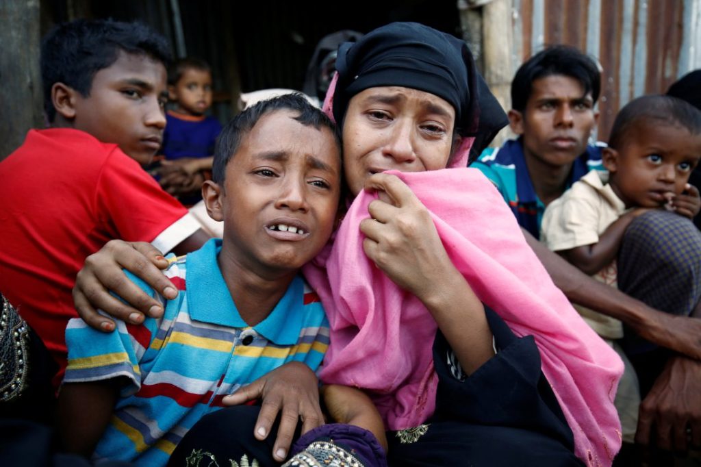 A Rohingya Muslim woman and her son cry after being caught by Border Guard Bangladesh while illegally crossing at a border check point in Cox's Bazar, Bangladesh, on Nov. 21, 2016. Mohammad Ponir Hossain—Reuters