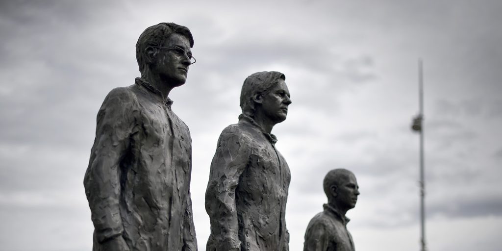 “Anything to Say?” is a bronze sculpture and art installation by Italian sculptor Davide Dormino, representing, from left, whistleblowers Edward Snowden, Julian Assange, and Chelsea Manning next to the U.N. offices in Geneva on Sept. 15, 2015.